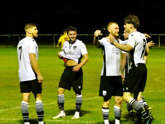 Bexhill United celebrate Evan Archibald's goal in their historic win over Lingfield. Pictures by Joe Knight