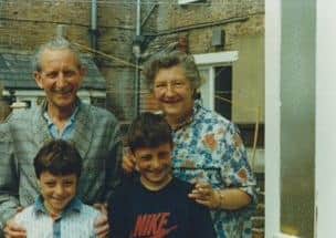 Irma and Charles Fears with their niece and nephew, Eastbourne 1984/5 SUS-210914-104709001