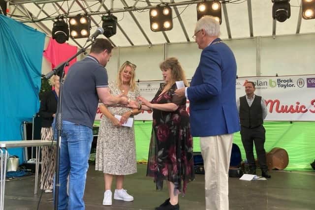 Fay Flude receiving her award from Ryan Andrews, sponsor of the Haywards Heath Covid-19 Community Support Awards. Picture: Haywards Heath Town Council.
