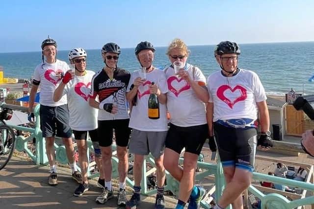 John Minch (centre with bottle) celebrating a successful bike ride with the other cyclists. Picture: Kate Minch.