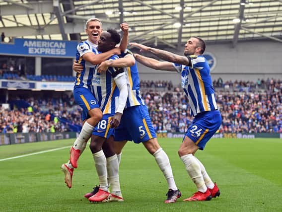 Brighton players celebrate their victory at the Amex Stadium