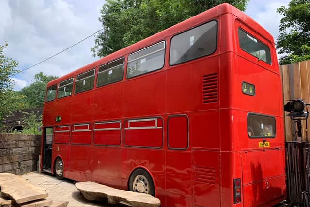 A double decker bus which is being used as a workshop in the garden of a Pulborough 'triangle house' as shown on Channel 4's Grand Designs