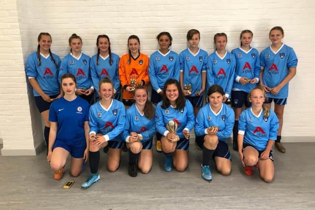 Girls at Southwater Royals Football Club in their new kit SUS-210921-113718001