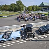 Beneficiaries and representatives at the Mission Motorsport event at Goodwood Motor circuit