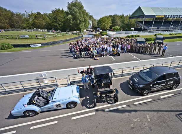 Beneficiaries and representatives at the Mission Motorsport event at Goodwood Motor circuit