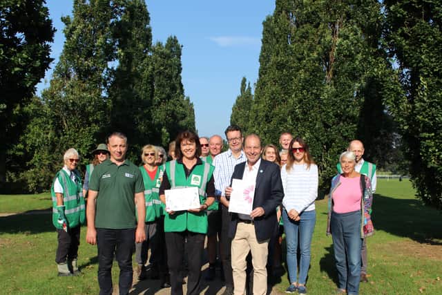 Horsham District Council Cabinet Member for Leisure and Culture Cllr Roger Noel, Cabinet Member for Horsham Town Centre Cllr Tony Hogben, Chair of Friends of Horsham Sally Sanderson and Chair of Denne Neighbourhood Council Trudie Mitchell celebrate the 2021 South and South East In Bloom awards win with the Council’s Parks and Countryside team and volunteers from Friends of Horsham Park.