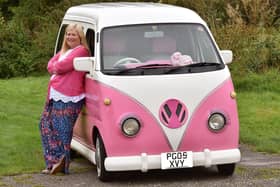 Janette Wilkinson with her pink camper van she has called Bagpuss - and a pink and white striped fluffy toy has pride of place on the dash board