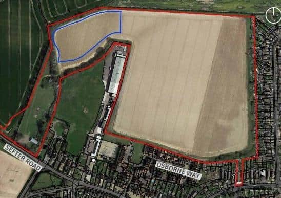 Reserved matters application site in red, blue is the potential site of a school or care home