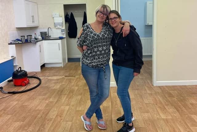 Suzie Coppard and her sister after emptying the salon
