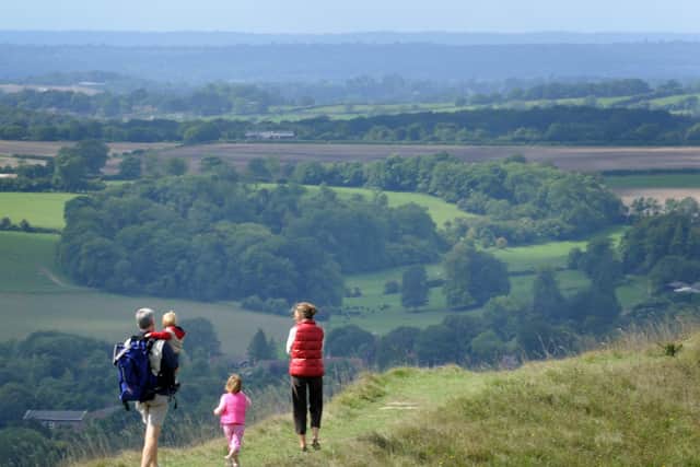 A family enjoying the one of the many great views the South Downs has to offer