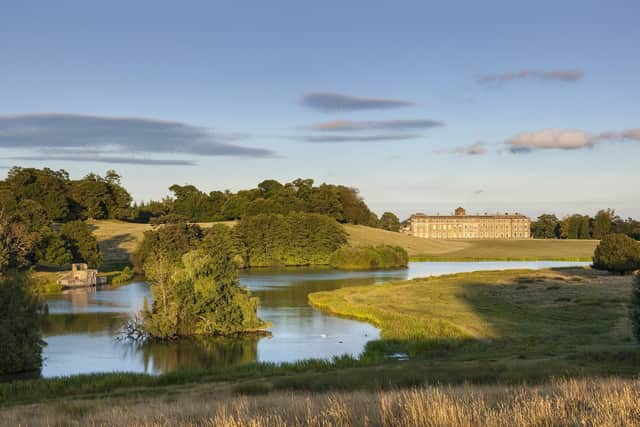 The house and upper pond at Petworth House and Park, West Sussex. The deer park at Petworth was landscaped by 'Capability' Brown.