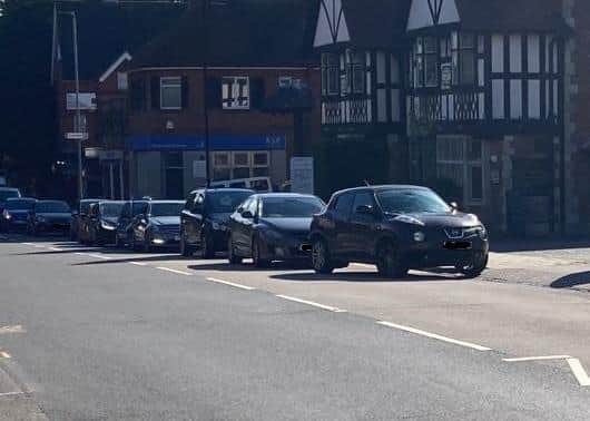 A queue of vehicles outside a petrol station in High Street, Old Town, Eastbourne SUS-210924-115747001