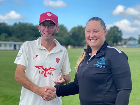 Lara, from the Sussex Cricket Foundation, presents Rudgwick Cricket Club's Jeremy Callaghan with the Unsung Hero Award