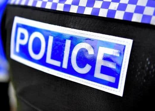 A group of men attempted to gain entry to a property in Crawley, said police.