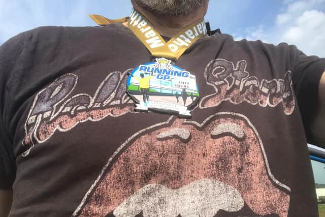 A medal - and that Rolling Stones T-shirt