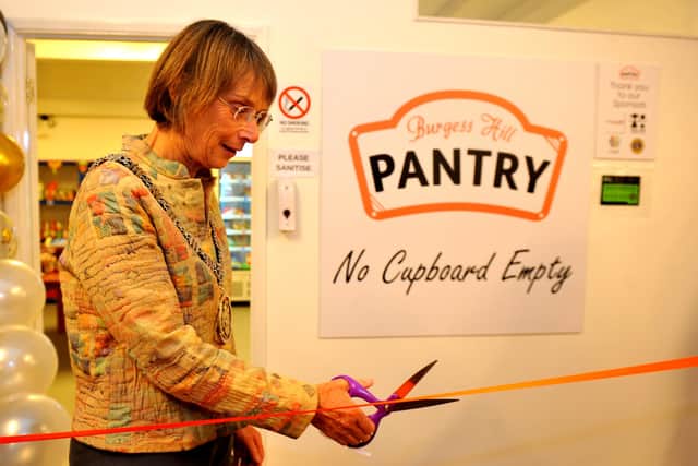 Burgess Hill town mayor Anne Eves cuts the ribbon at the official launch of Burgess Hill Pantry. Picture: Steve Robards, SR2109271.