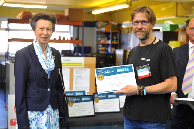Princess Anne presents a long service certificate to Colin Grimsley from Haywards Heath. Picture: Steve Robards.