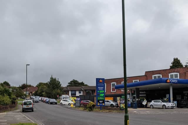 Cars queueing for petrol along Mill Lane, Storrington