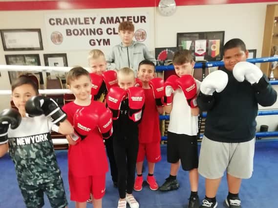Crawley Boxing Club’s new batch of young hopefuls with junior star Harry Parsons