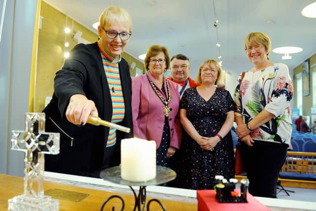 Flashback to 2019, when Dawn Carn, minister of Offington Park Methodist Church, lit the peace candle to launch Worthing Mental Health Awareness Week, watched by Hazel Thorpe, Bob Smytherman, Carol Barber, and Val Turner. Picture: Kate Shemilt ks190553-1