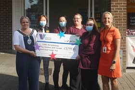 Littlehampton mayor Michelle Molloy with, from left, Sainsbury's manager Rong Healsewood and colleagues Vicci, Tracey and Anna presenting the cheque to Christine Gillott, senior fundraiser at Care for Veterans