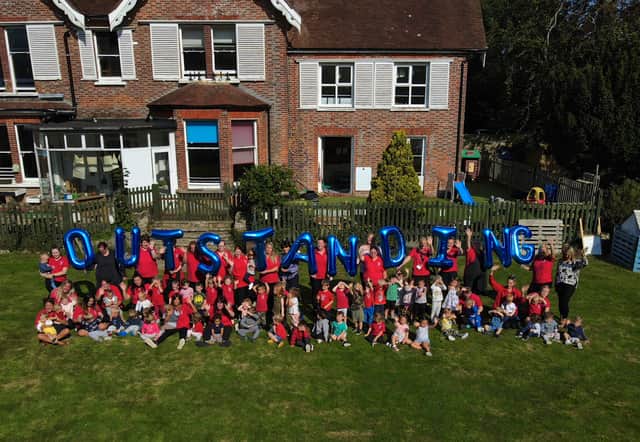 Children and staff celebrate the nursery receiving an 'outstanding' rating by Ofsted SUS-210930-172112001