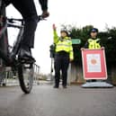 PCSOs stop a cyclist on a footpath.Picture: Allan Hutchings (150133-430) PPP-150126-150450001
