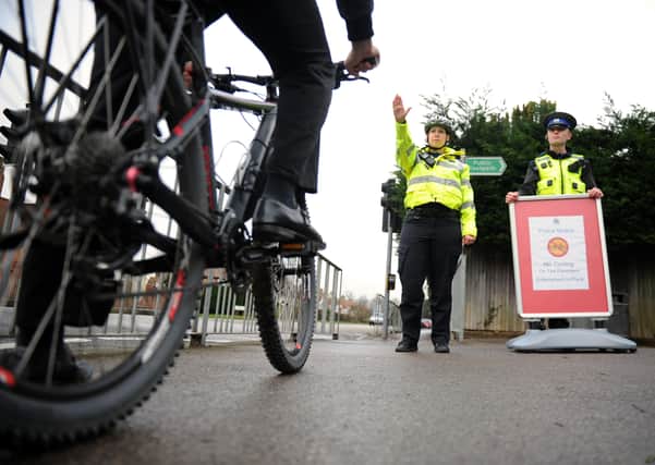 PCSOs stop a cyclist on a footpath.

Picture: Allan Hutchings (150133-430) PPP-150126-150450001