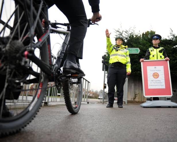 PCSOs stop a cyclist on a footpath.Picture: Allan Hutchings (150133-430) PPP-150126-150450001