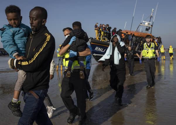 A group of migrants arrive via the RNLI (Royal National Lifeboat Institution) (Photo by Dan Kitwood/Getty Images)