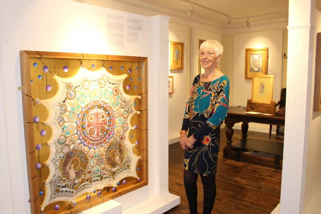 Artist Judith Hurst with one of her works Asymetric Symmetry