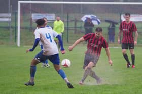 Jake Chadwick in action for Billingshurst during Saturday's thrilling win over Epsom & Ewell amid torrential rain. Pictures by Iain Gibson