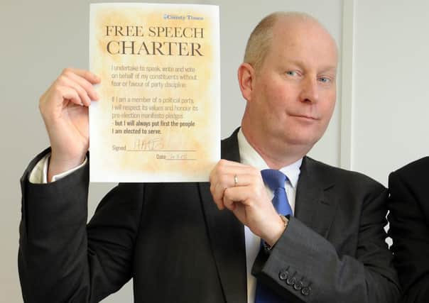 Adrian Lee pictured in 2015 signing the County Times' Free Speech Charter