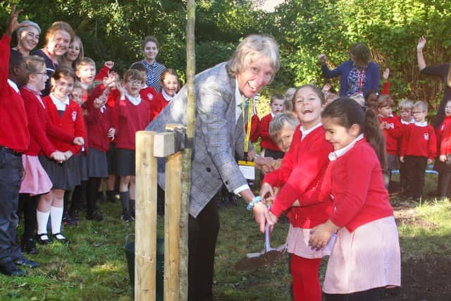The Lord-Lieutenant of West Sussex, Susan Pyper, planting the commemorative tree with Rumboldswhyke pupils. Picture by Derek Martin