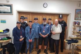 Members of Street Pastors with police officers. Picture from Sussex Police SUS-210710-174148001