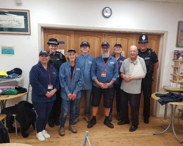 Members of Street Pastors with police officers. Picture from Sussex Police SUS-210710-174148001