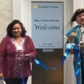 Founder Ann Marie Lovejoy Bruce-Kerr cuts the ribbon to open the Lovejoy Centre's new Day Centre Service in Broadwater with Worthing town crier Bob Smytherman