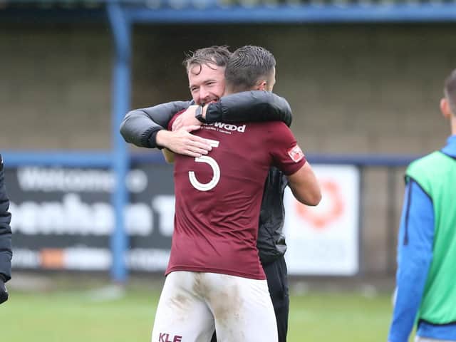 Manager Chris Agutter embraces one of his players after Hastings United's famous FA Cup win over National League South side Chippenham Town. Pictures by Scott White