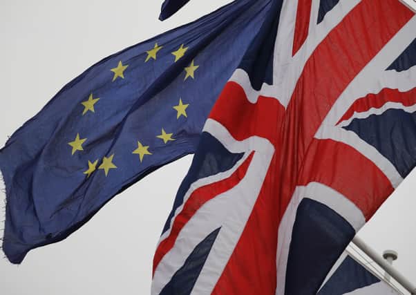An EU Flag with a Union Flag  (Photo by TOLGA AKMEN/AFP via Getty Images)