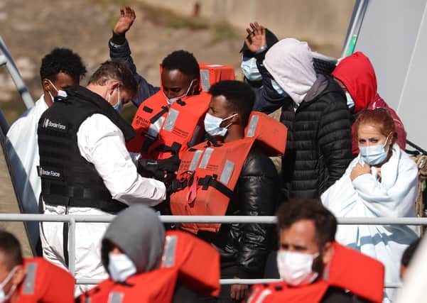 Migrants are brought into Dover docks by Border Force staff (Photo by Dan Kitwood/Getty Images)