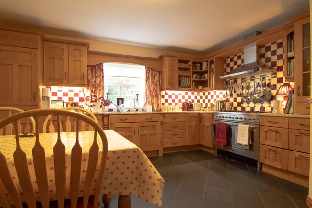 The spacious kitchen has room for family dining.