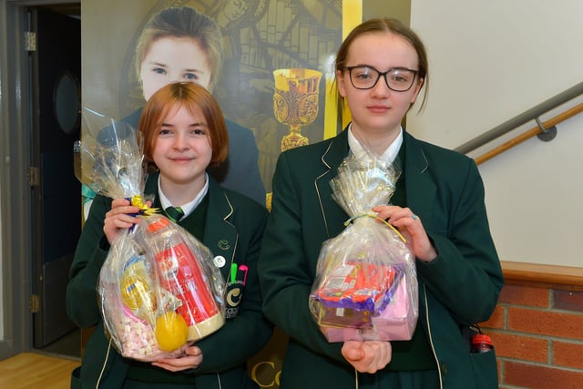 Aoibheann Flood and Katie McConnellogue, Year 8 pupils at St Cecilia’s College pictured with their prizes from a draw held during a pancake breakfast at the school on Tuesday morning last. DER2209GS – 021