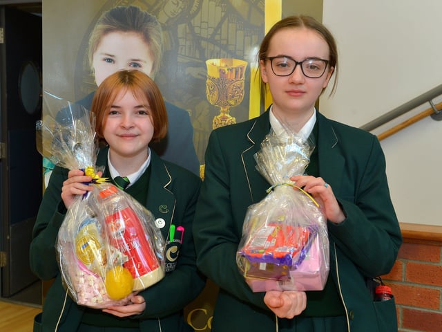 Aoibheann Flood and Katie McConnellogue, Year 8 pupils at St Cecilia’s College pictured with their prizes from a draw held during a pancake breakfast at the school on Tuesday morning last. DER2209GS – 021