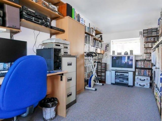 The fourth bedroom, currently used as an office, has dual-aspect windows