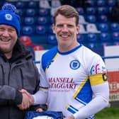 Byron Napper is presented with a gift to mark 200 appearances for Haywards Heath Town | Picture: Ray Turner