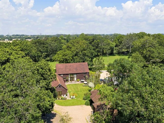This five bed converted barn in Anmore Road, Denmead is on the market for £1.4m. It is listed on Zoopla by White & Guard Estate Agents.