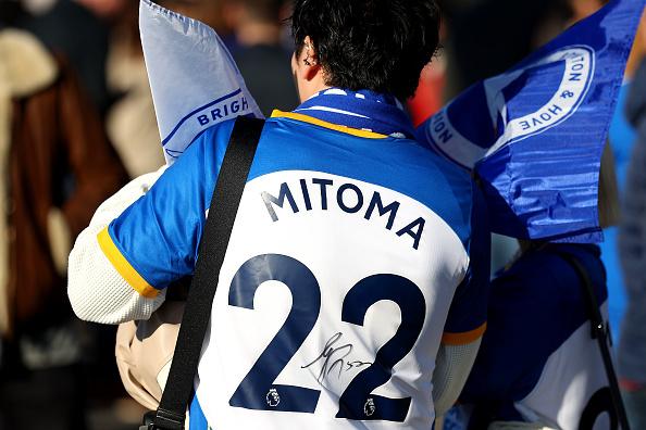 A Brighton & Hove Albion fan is seen wearing a Kaoru Mitoma shirt outside the stadium prior to the Premier League match between Brighton & Hove Albion and Aston Villa