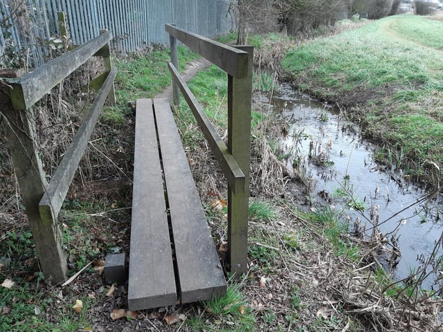 There is a small wooden bridge to cross and then you are soon back at Ferring Rife