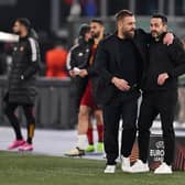 Daniele De Rossi, Head Coach of AS Roma, embraces Roberto De Zerbi, Manager of Brighton & Hove Albion, at full-time in Rome