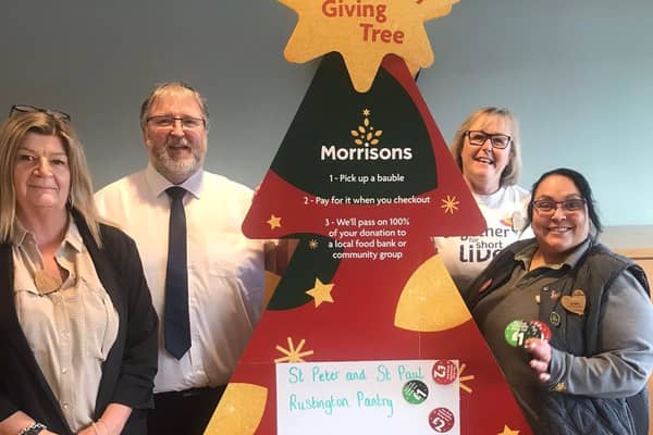 Celebrating the success of the Community Giving Tree at Morrisons in Littlehampton, services manager Sharon Brockwell, store manager Shaun Schofield, community champion Alison Whitburn and team leader Lynsey Porter